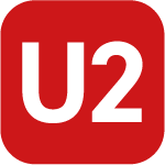 Das Bild zeigt ein quadratisches Symbol mit rotem Hintergrund und der weißen Aufschrift U2 in der Mitte. Es handelt sich um das Linienkennzeichen der U-Bahn-Linie U2, das zur Orientierung im öffentlichen Nahverkehr dient. Die Gestaltung ist klar und kontrastreich, um eine gute Lesbarkeit zu gewährleisten.